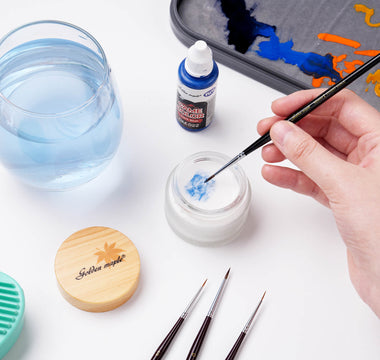 Cleaning brushes with soap.