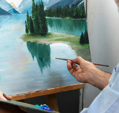 A man painted a picture with brushes.