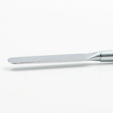 Close-up shot of the precise round tip of a metal sculpting tool, for fine detail work.