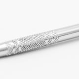 Close-up of the textured grip on a metal sculpting tool's handle, providing enhanced control for artists.