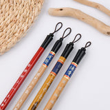 4 traditional Chinese calligraphy brushes featuring various natural wood handles and hanging loops.