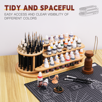 On the desktop are placed a paintbrush and paint organizer, a miniature handle, paints, and brushes.