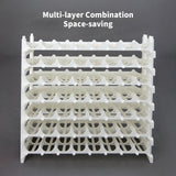 White multi-layer acrylic composable rack, showcasing its space-saving design for organized paint storage.