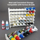 White acrylic paint storage rack holding various model paints, emphasizing neat storage and multi-brand compatibility.