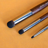 Three dry brushing brushes of different sizes.