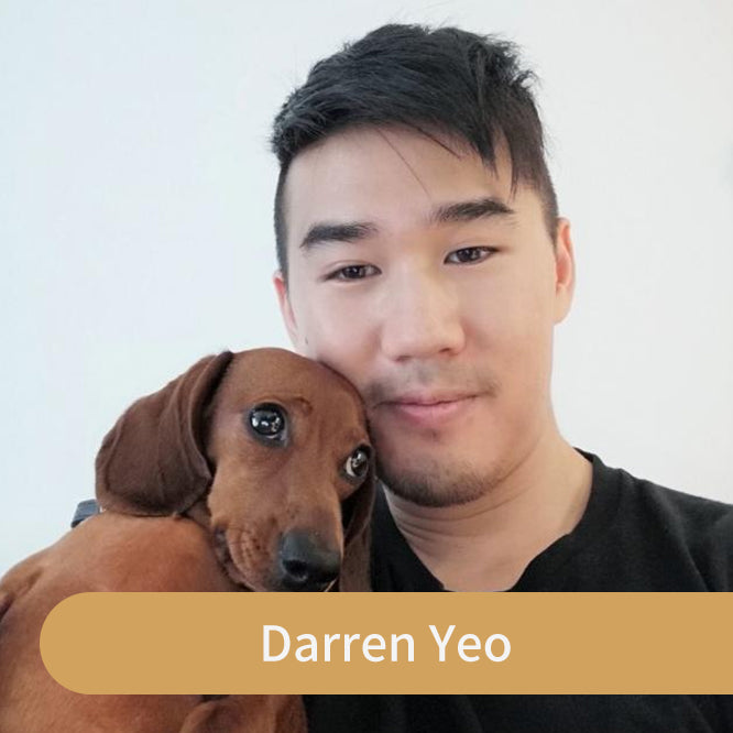 Darren Yeo, GoldenMaple artist, with his brown dachshund.