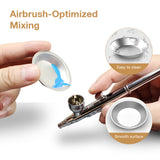 Pour the thinned paint from the palette into the airbrush.