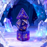 Three polyhedral dice of different shapes stacked together.