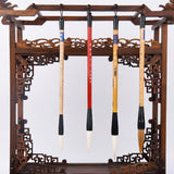 4 GoldenMaple Chinese Calligraphy Brushes on a carved wooden brush holder. Natural hair Sumi-e painting brushes art display.