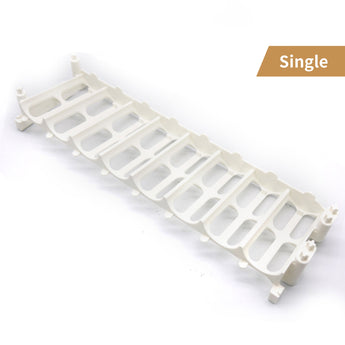 A single, empty white acrylic module, part of the larger composable paint bottle storage rack system.