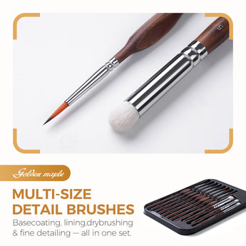 A fine detail brush and drybrush next to a tray holding eleven ergonomic miniature painting brushes.