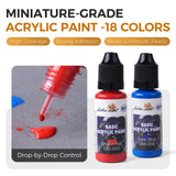 Squeeze dropper bottles of Golden Maple miniature-grade acrylic paint in bright red and dark blue colors.