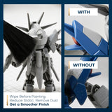 Anti-static brush removing dust from plastic model kit parts before painting for a smooth finish.