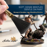 Soft, dense anti-static bristles gently dusting miniature figurines without damaging delicate paint jobs.