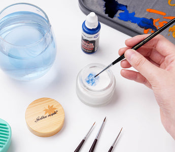 Cleaning brushes with soap.