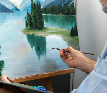 A man painted a picture with brushes.