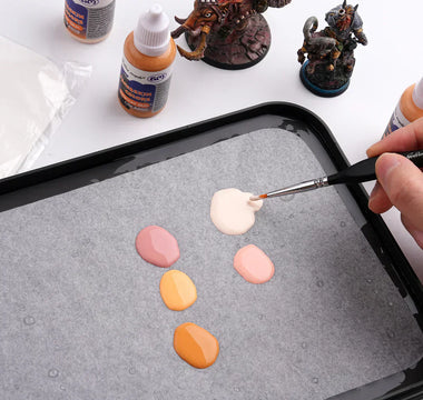 Mix acrylic paints for painting miniatures.