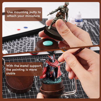 Miniature painting handle in use, showing a figure attached with mounting putty for stable and precise detailing.