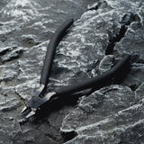 A single-edged cutting pliers placed on a rock.​
