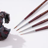 Set of professional detail brushes in sizes 2/0 to 5/0 for precision miniature painting.
