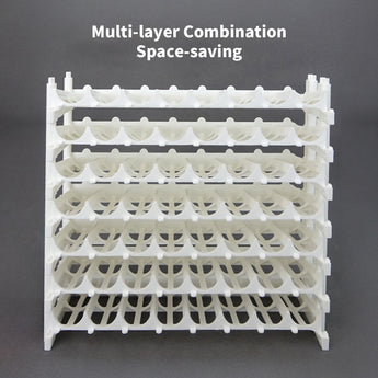 White multi-layer acrylic composable rack, showcasing its space-saving design for organized paint storage.