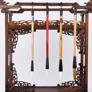 4 GoldenMaple Chinese Calligraphy Brushes on a carved wooden brush holder. Natural hair Sumi-e painting brushes art display.