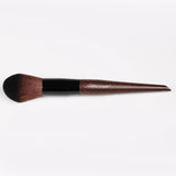 A dark-colored premium fiber hair brush​.
