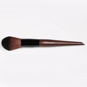 A dark-colored premium fiber hair brush​.